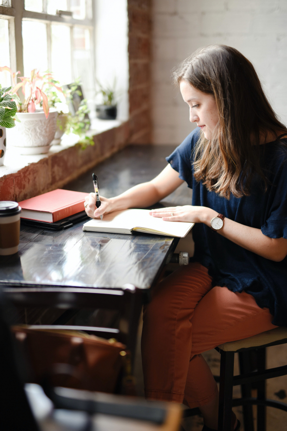 Woman writing at a desk